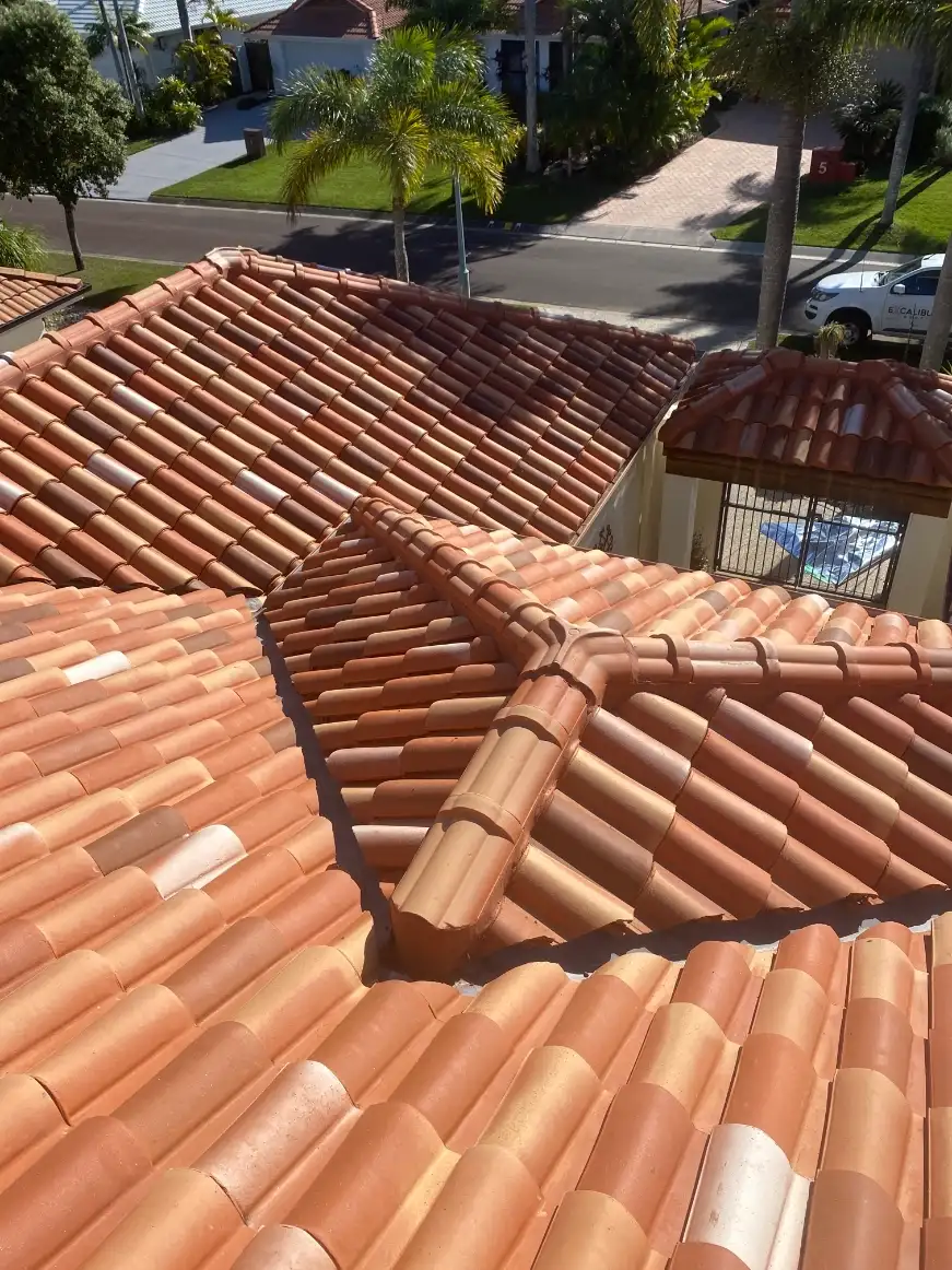 Traditional terracotta roof tile ridge capping being restored